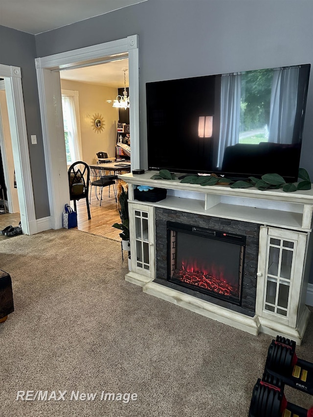 419 N Birney St, Bay City, MI 48708 - carpeted living room with a fireplace and baseboards