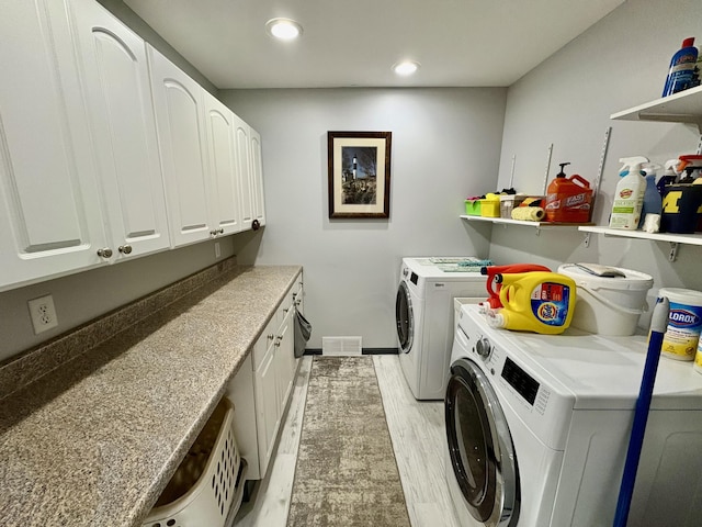 12141 Lawrence Rd, Brooklyn, MI 49230 - washroom with washing machine and dryer, light wood finished floors, cabinet space, and recessed lighting