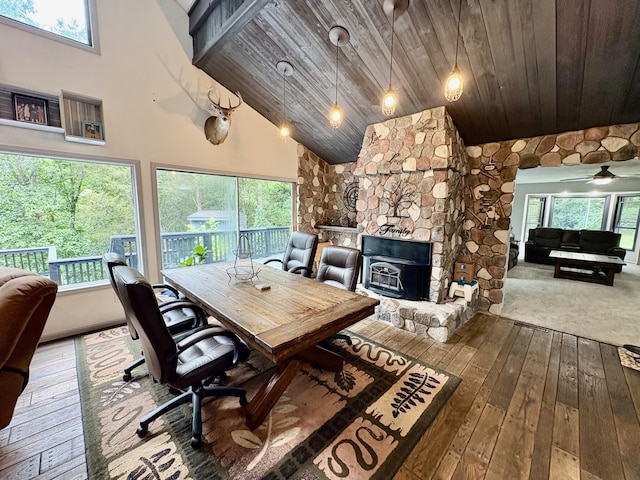 12141 Lawrence Rd, Brooklyn, MI 49230 - home office with wood ceiling, hardwood / wood-style flooring, healthy amount of natural light, high vaulted ceiling, and a wood stove