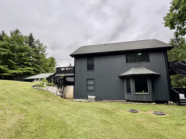 12141 Lawrence Rd, Brooklyn, MI 49230 - rear view of house featuring a lawn and stairs
