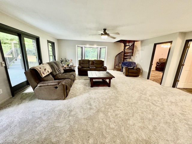 12141 Lawrence Rd, Brooklyn, MI 49230 - living area with a ceiling fan, stairway, and carpet