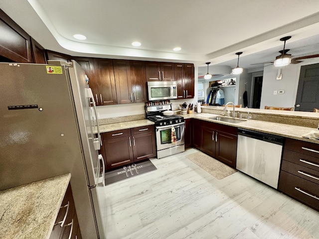 12141 Lawrence Rd, Brooklyn, MI 49230 - kitchen with appliances with stainless steel finishes, ceiling fan, recessed lighting, hanging light fixtures, and light stone countertops