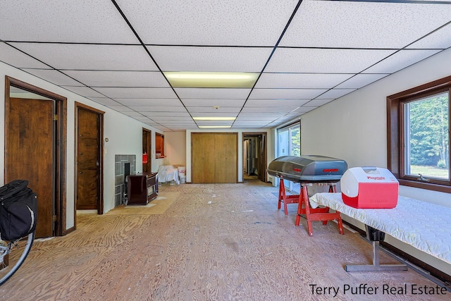 2860 Fenner Rd, Muskegon, MI 49445 - recreation room with a drop ceiling and light wood finished floors