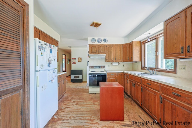 2860 Fenner Rd, Muskegon, MI 49445 - kitchen featuring freestanding refrigerator, electric range oven, under cabinet range hood, and light countertops