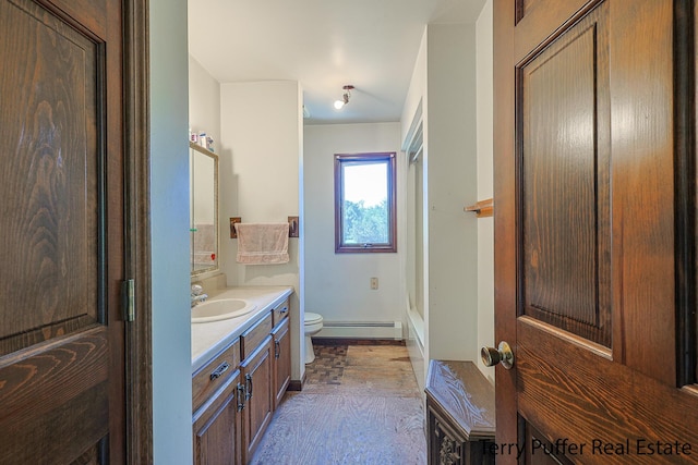 2860 Fenner Rd, Muskegon, MI 49445 - full bath featuring a baseboard heating unit, vanity, and washtub / shower combination