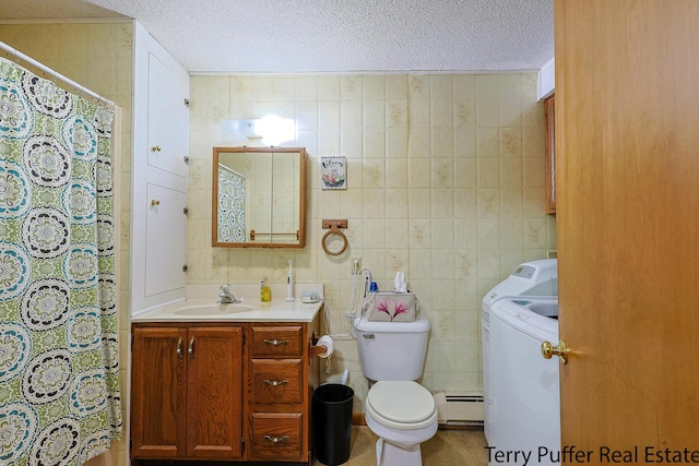 2860 Fenner Rd, Muskegon, MI 49445 - bathroom featuring washer / clothes dryer, a textured ceiling, vanity, a baseboard heating unit, and a shower with shower curtain