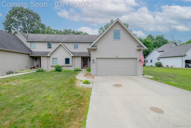 1435 Sunset Blvd, Flint, MI 48507 - traditional home featuring a front lawn, an attached garage, and concrete driveway