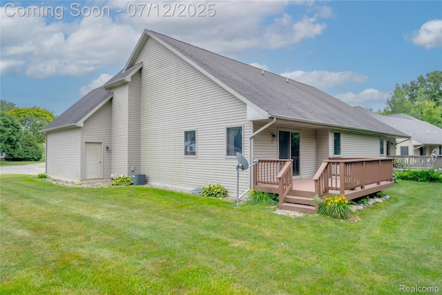 1435 Sunset Blvd, Flint, MI 48507 - back of house featuring a deck, a lawn, and roof with shingles