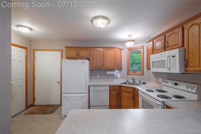 1435 Sunset Blvd, Flint, MI 48507 - kitchen with white appliances, light countertops, and brown cabinetry