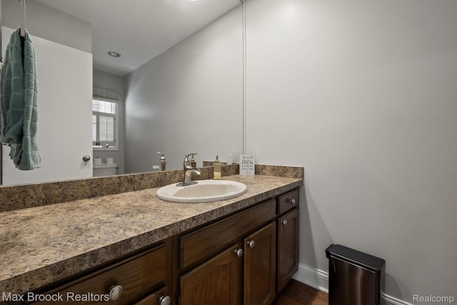 1125 Meadowglen Ct, Bloomfield Hills, MI 48304 - half bathroom with vanity and wood finished floors