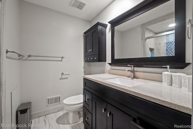 1125 Meadowglen Ct, Bloomfield Hills, MI 48304 - bathroom with vanity, marble look tiles, and a shower with shower door