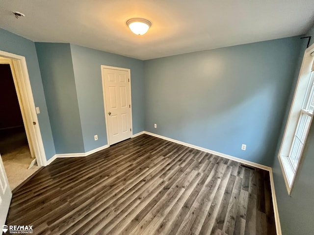 1421 Newcastle Dr, Davison, MI 48423 - unfurnished room with dark wood-style flooring