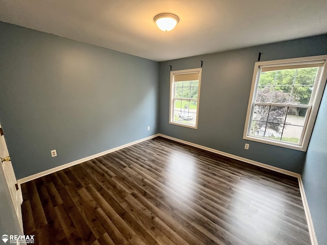 1421 Newcastle Dr, Davison, MI 48423 - unfurnished room featuring dark wood-style floors