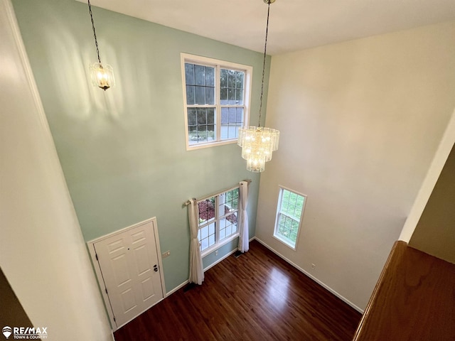 1421 Newcastle Dr, Davison, MI 48423 - foyer entrance with wood finished floors, a chandelier, and a high ceiling