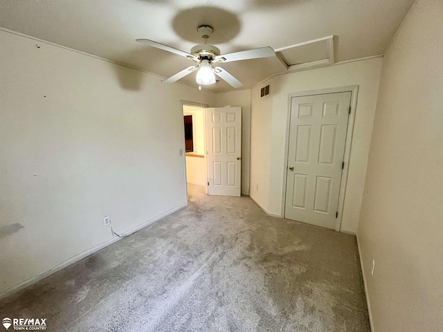 1421 Newcastle Dr, Davison, MI 48423 - unfurnished bedroom with carpet floors, attic access, and ceiling fan
