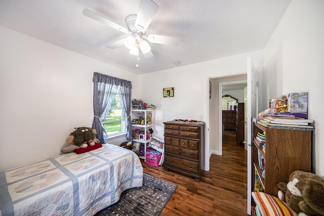 119 Burt Ave, Jackson, MI 49201 - bedroom with wood finished floors and a ceiling fan