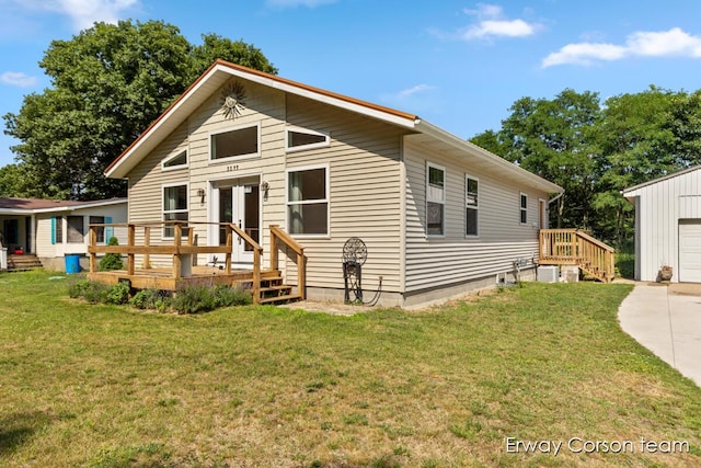 5599 Marsh Rd, Shelbyville, MI 49344 - view of front of house featuring an outbuilding, a deck, a front lawn, and a detached garage