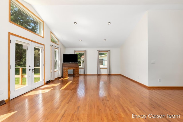 5599 Marsh Rd, Shelbyville, MI 49344 - unfurnished living room featuring french doors, vaulted ceiling, and light wood-style floors