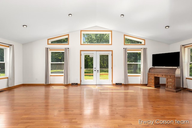 5599 Marsh Rd, Shelbyville, MI 49344 - unfurnished living room with lofted ceiling, light wood finished floors, french doors, and healthy amount of natural light