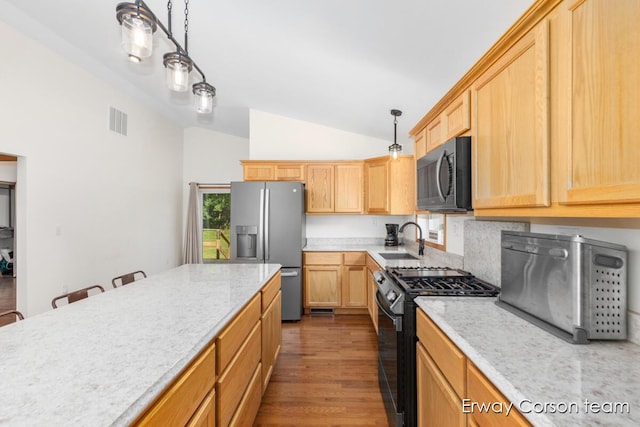 5599 Marsh Rd, Shelbyville, MI 49344 - kitchen featuring black gas range oven, stainless steel refrigerator with ice dispenser, lofted ceiling, light brown cabinets, and dark wood finished floors
