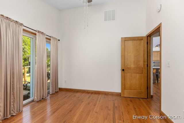 5599 Marsh Rd, Shelbyville, MI 49344 - empty room featuring a high ceiling, light wood finished floors, a smoke detector, and ceiling fan