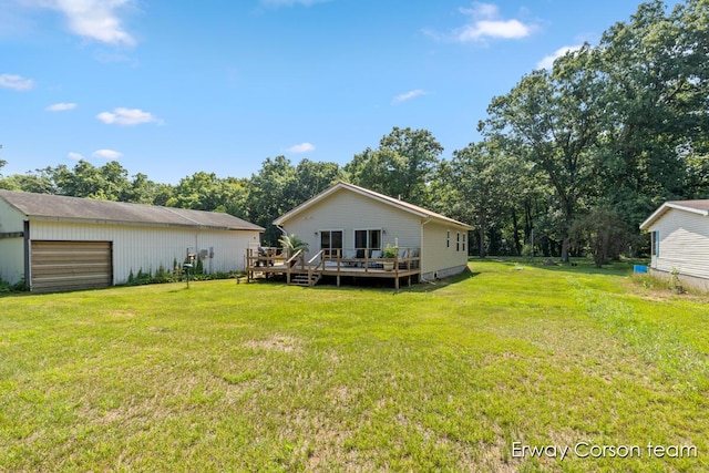 5599 Marsh Rd, Shelbyville, MI 49344 - view of grassy yard featuring a deck, an outdoor structure, and a garage