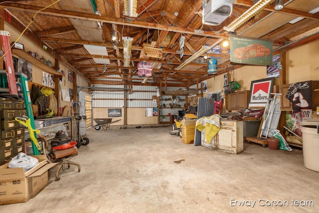 5599 Marsh Rd, Shelbyville, MI 49344 - garage featuring a garage door opener