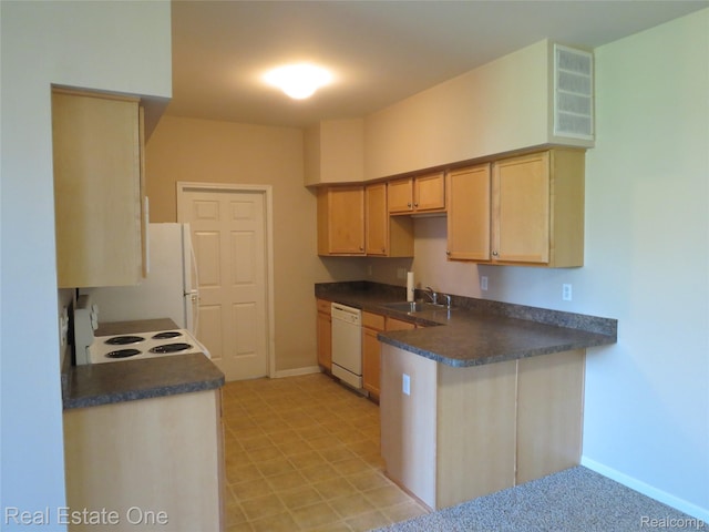 3153 Kneeland Cir, Howell, MI 48843 - kitchen featuring white appliances, dark countertops, a peninsula, and light brown cabinetry