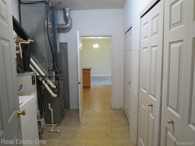 3153 Kneeland Cir, Howell, MI 48843 - washroom with washer / dryer and a chandelier