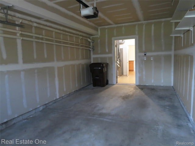 3153 Kneeland Cir, Howell, MI 48843 - garage featuring a garage door opener