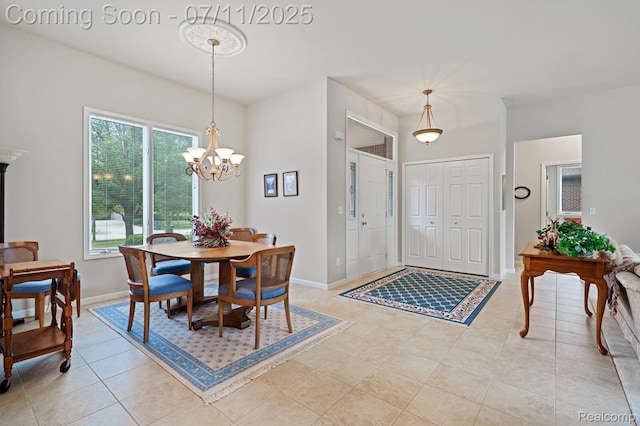 13823 Blue Beech Ln, Shelby Twp, MI 48315 - dining room featuring light tile patterned floors and a chandelier