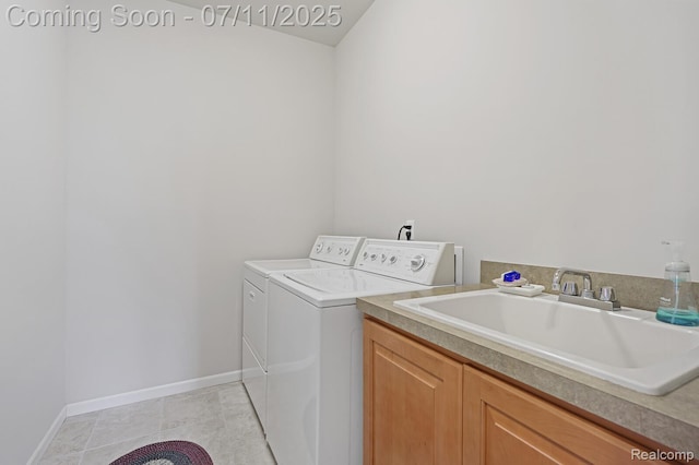 13823 Blue Beech Ln, Shelby Twp, MI 48315 - washroom featuring separate washer and dryer, light tile patterned flooring, and cabinet space