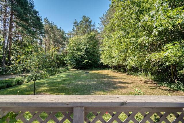 13113 Pinewood St NE, Gowen, MI 49326 - view of grassy yard with a wooden deck