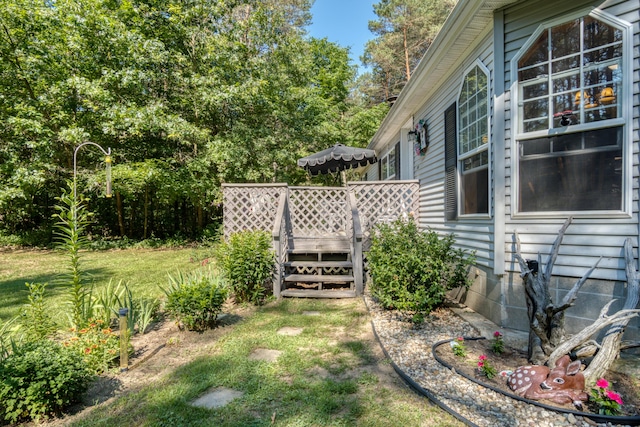 13113 Pinewood St NE, Gowen, MI 49326 - view of green lawn featuring a wooden deck