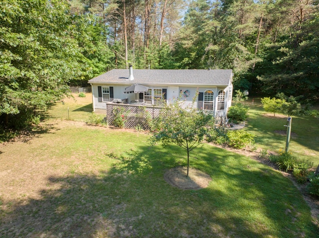 13113 Pinewood St NE, Gowen, MI 49326 - view of front of home with a deck and a front yard