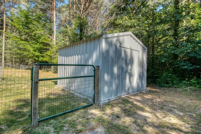 13113 Pinewood St NE, Gowen, MI 49326 - view of shed with a gate
