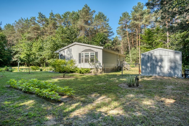13113 Pinewood St NE, Gowen, MI 49326 - view of green lawn with an outdoor structure