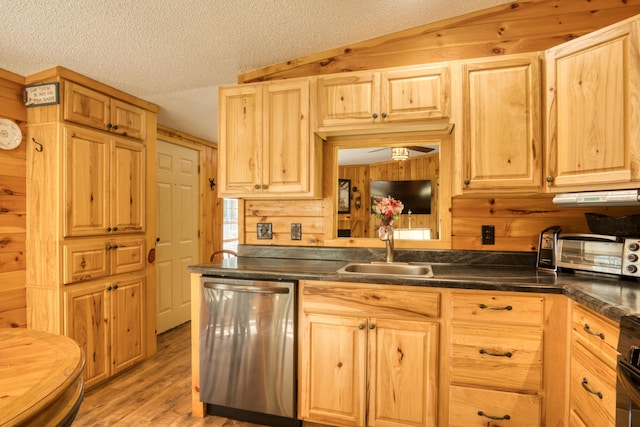 13113 Pinewood St NE, Gowen, MI 49326 - kitchen featuring stainless steel dishwasher, dark countertops, light brown cabinets, light wood-style flooring, and a textured ceiling