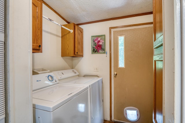 13113 Pinewood St NE, Gowen, MI 49326 - washroom featuring washer and dryer, a textured ceiling, and cabinet space