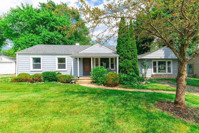 8876 Sheldon Rd, Plymouth, MI 48170 - ranch-style house featuring a front lawn, a chimney, roof with shingles, and covered porch