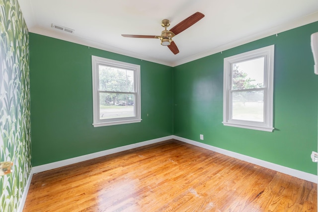 8876 Sheldon Rd, Plymouth, MI 48170 - empty room with wood finished floors, a ceiling fan, and ornamental molding