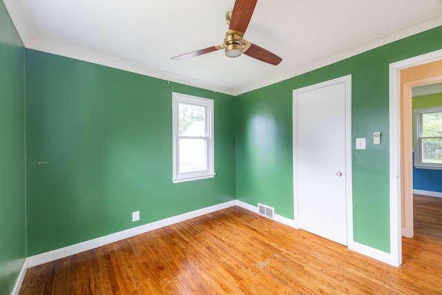 8876 Sheldon Rd, Plymouth, MI 48170 - unfurnished bedroom featuring wood finished floors, crown molding, and a ceiling fan