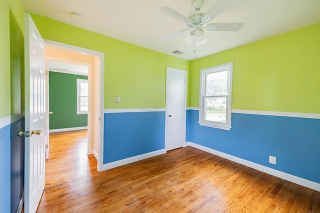 8876 Sheldon Rd, Plymouth, MI 48170 - unfurnished room with plenty of natural light, ceiling fan, and wood finished floors