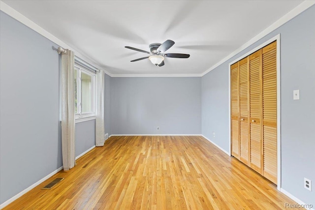 12360 Moers Dr, Sterling Heights, MI 48313 - unfurnished bedroom featuring light wood-style floors, crown molding, a closet, and ceiling fan
