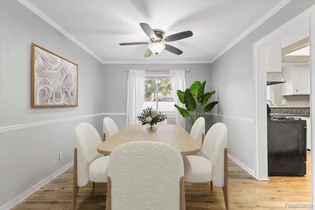 12360 Moers Dr, Sterling Heights, MI 48313 - dining room with ceiling fan, light wood finished floors, and crown molding