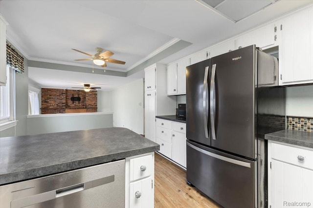 12360 Moers Dr, Sterling Heights, MI 48313 - kitchen with appliances with stainless steel finishes, dark countertops, ceiling fan, light wood finished floors, and white cabinetry