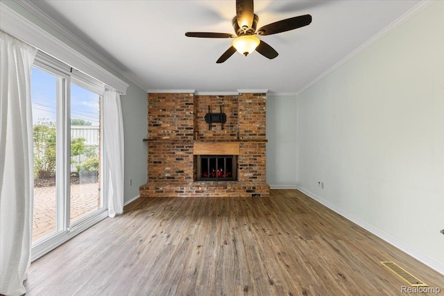 12360 Moers Dr, Sterling Heights, MI 48313 - unfurnished living room featuring wood finished floors, a brick fireplace, ornamental molding, and ceiling fan