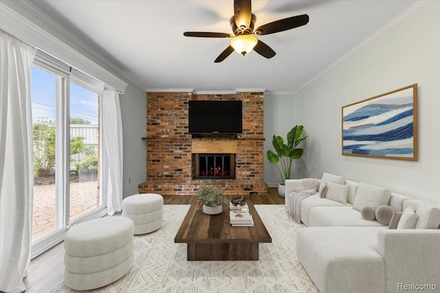 12360 Moers Dr, Sterling Heights, MI 48313 - living area featuring crown molding, wood finished floors, a ceiling fan, and a brick fireplace