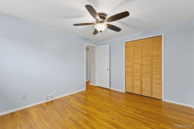12360 Moers Dr, Sterling Heights, MI 48313 - unfurnished bedroom featuring light wood-style flooring, a closet, and ceiling fan
