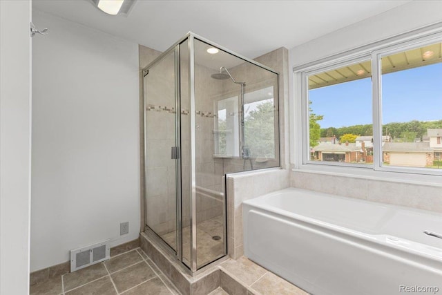 12360 Moers Dr, Sterling Heights, MI 48313 - bathroom with a bath, a shower stall, and tile patterned floors
